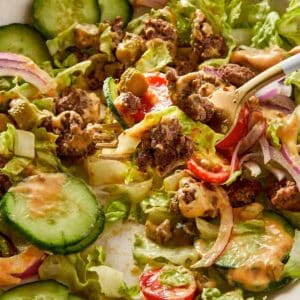 Close Up Burger Bowl with secret Sauce in a beige surface