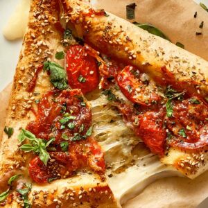 close up of cheese being pulled of an easy tortilla pizza