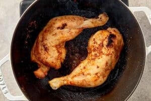 Searing seasoned chicken for cabbage chicken soup until golden to develop rich flavor