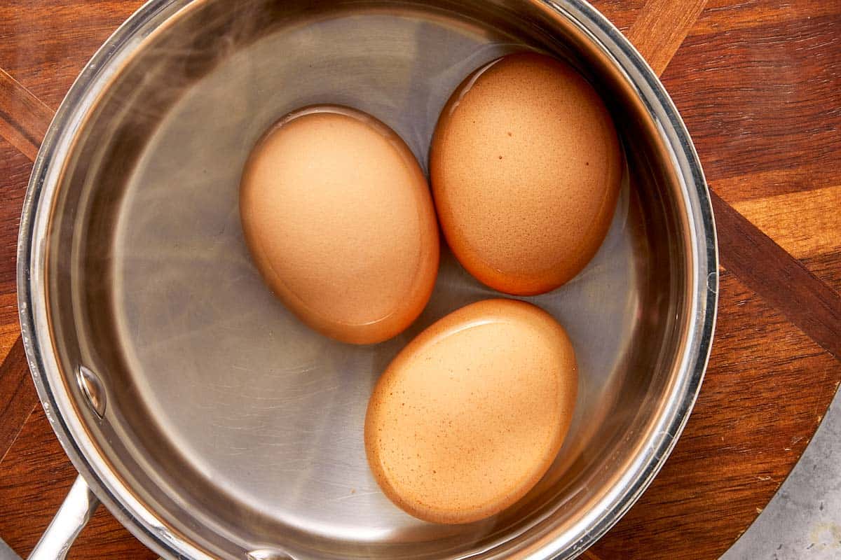 Eggs in a pot of water ready to be boiled for deviled potato filling