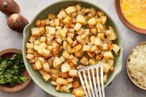 Potatoes softened and lightly golden for tortilla española
