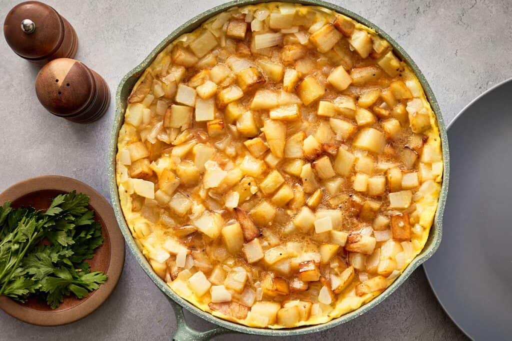 Tortilla española partially set with soft center