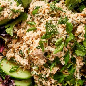 healthy tuna salad with cucumber and mixed greens in a bowl