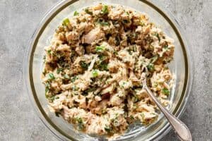 tuna salad mixed with herbs and pickles showing texture and freshness