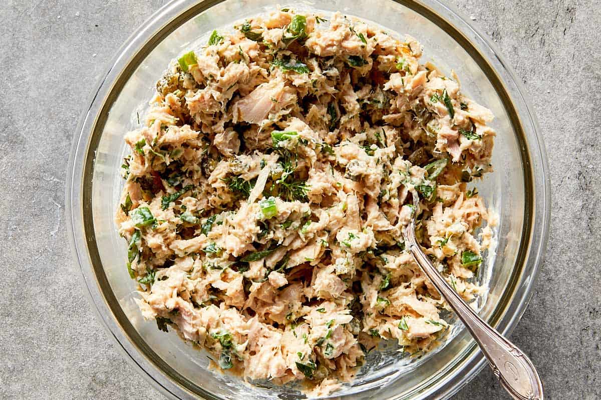 tuna salad mixed with herbs and pickles showing texture and freshness