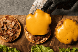 adding cheddar cheese in the meat