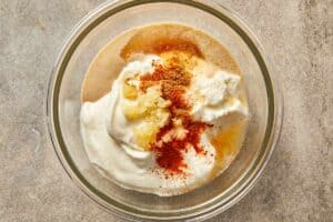 yogurt, tahini, honey, lime juice, garlic, salt, cayenne, and ground coriander in a bowl
