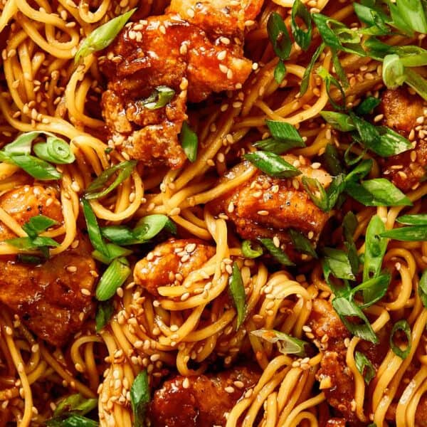 Close-up of honey sesame chicken noodles