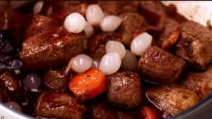 onion pearls and beef sock in the wine and stock for Beef Bourguignon