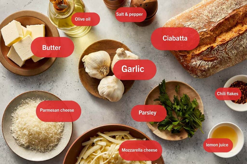 Top view of Ingredients for garlic bread labeled with cafedelites color