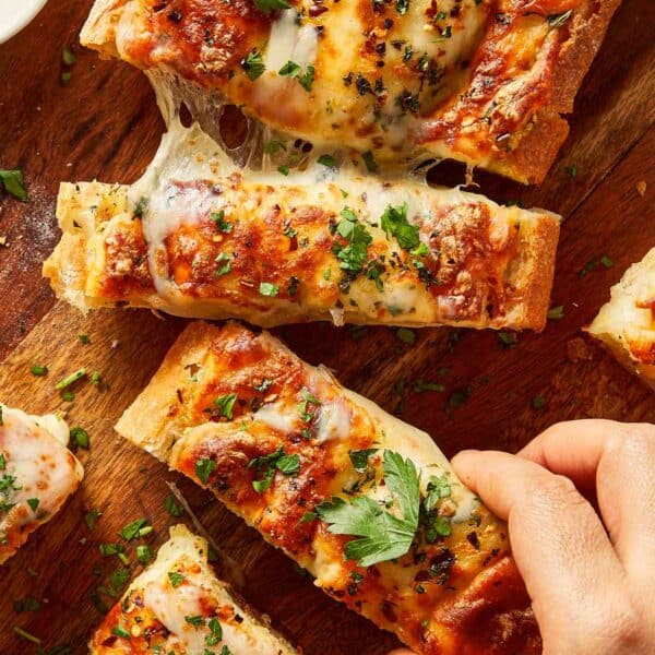 Pulling a piece of garlic bread