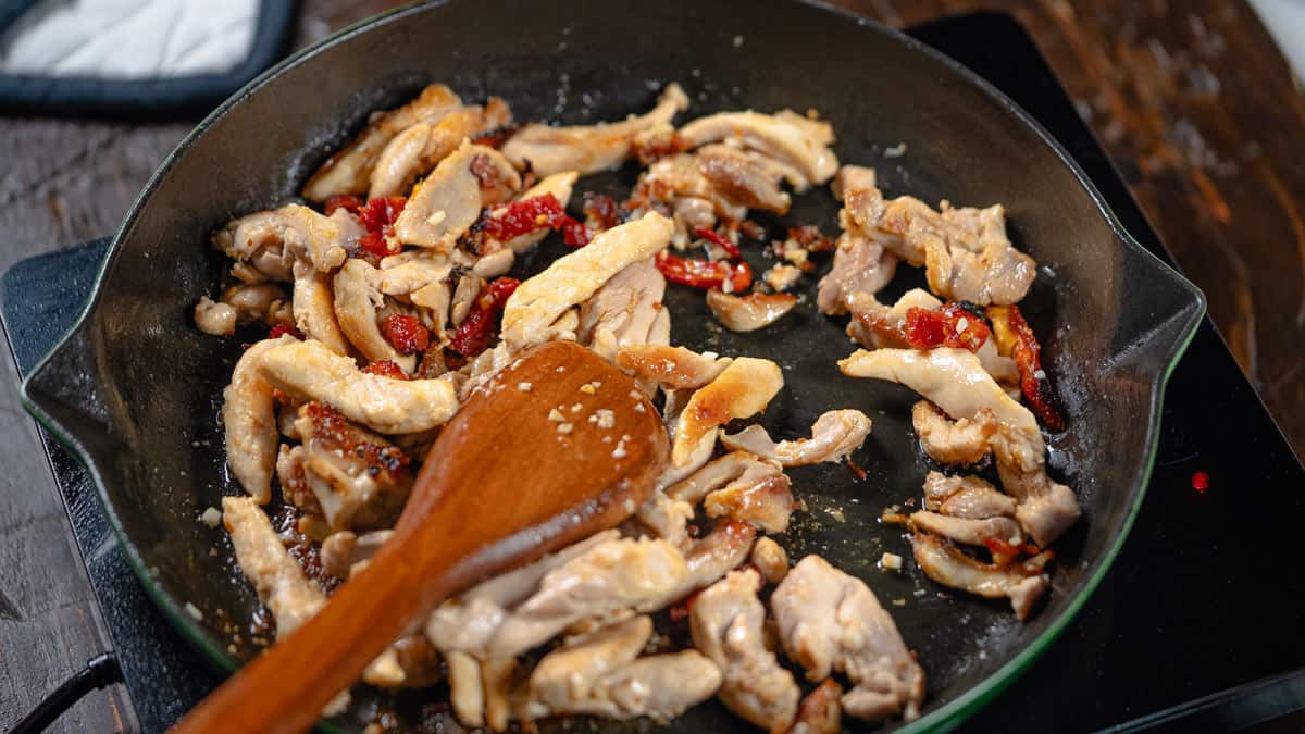tomatoes in a pan with the chicken