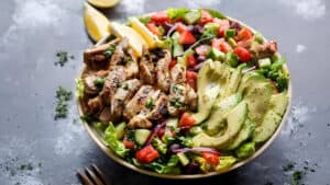 Grilled Lemon Herb Mediterranean Chicken Salad in a plater